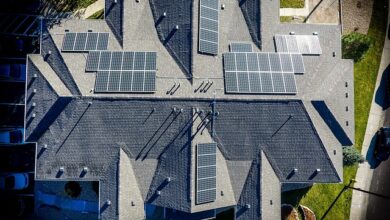 Renewable energy and energy efficiency in action with solar panels on a large house roof.